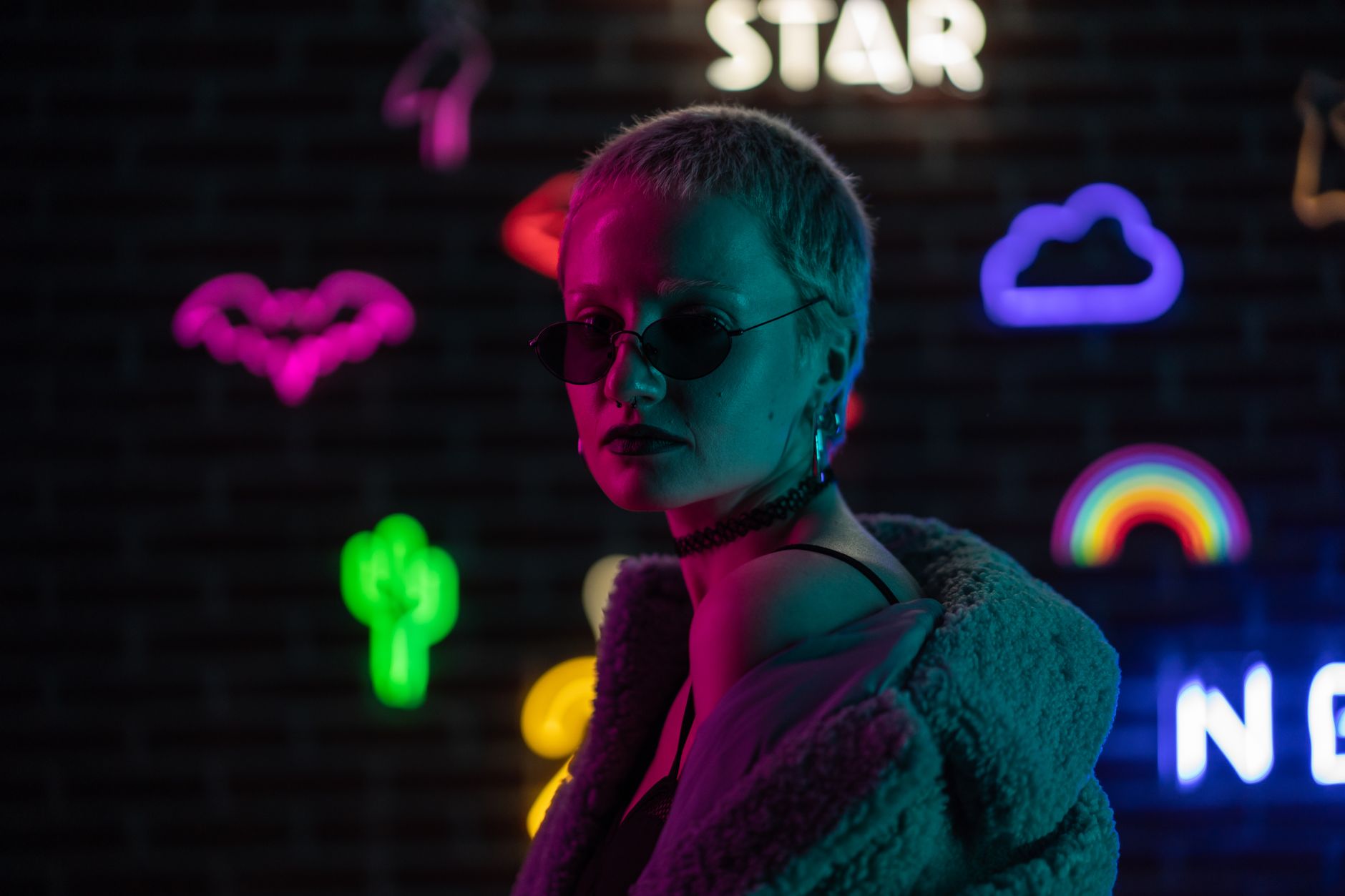 A pop artist in minimalist fashion styling backstage at a music event