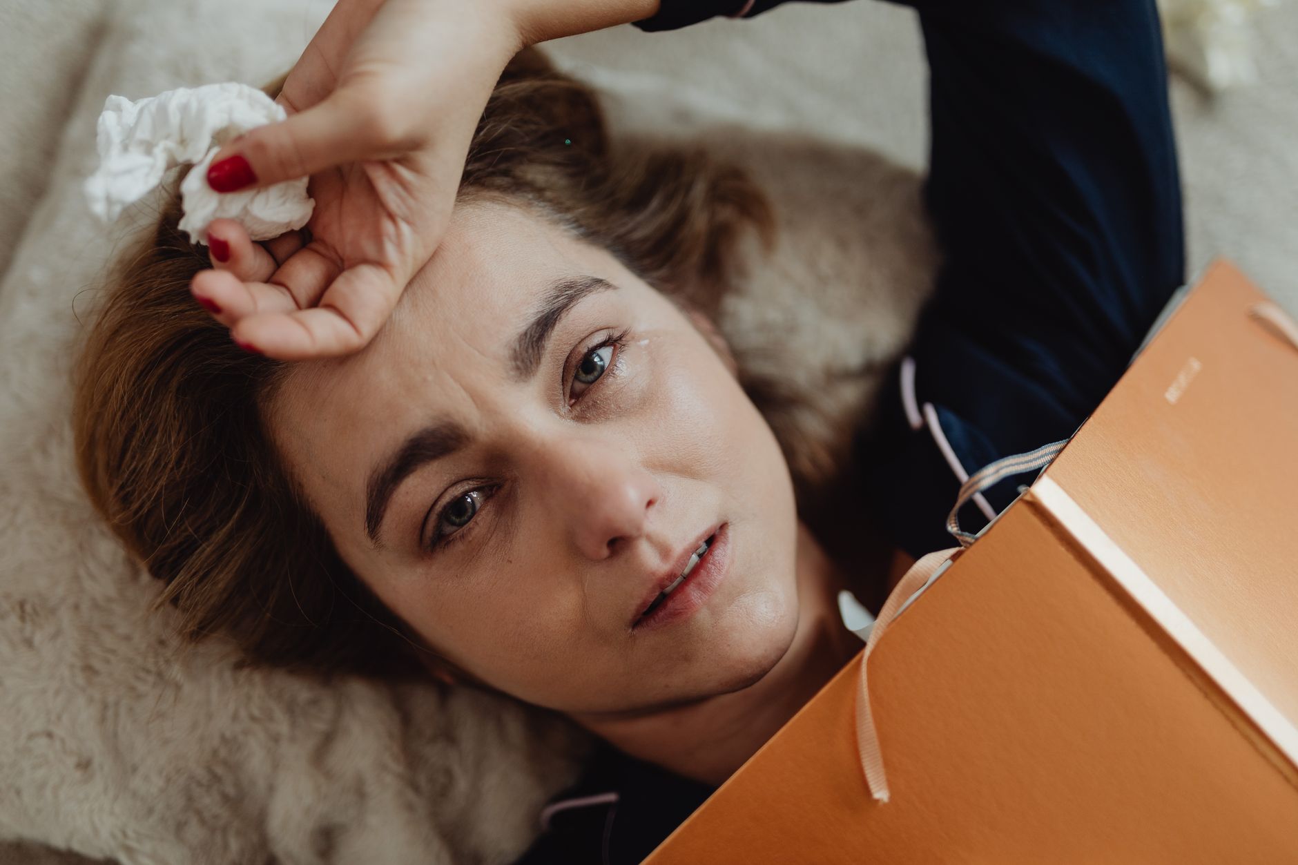 A box of tissues beside someone watching a film at home