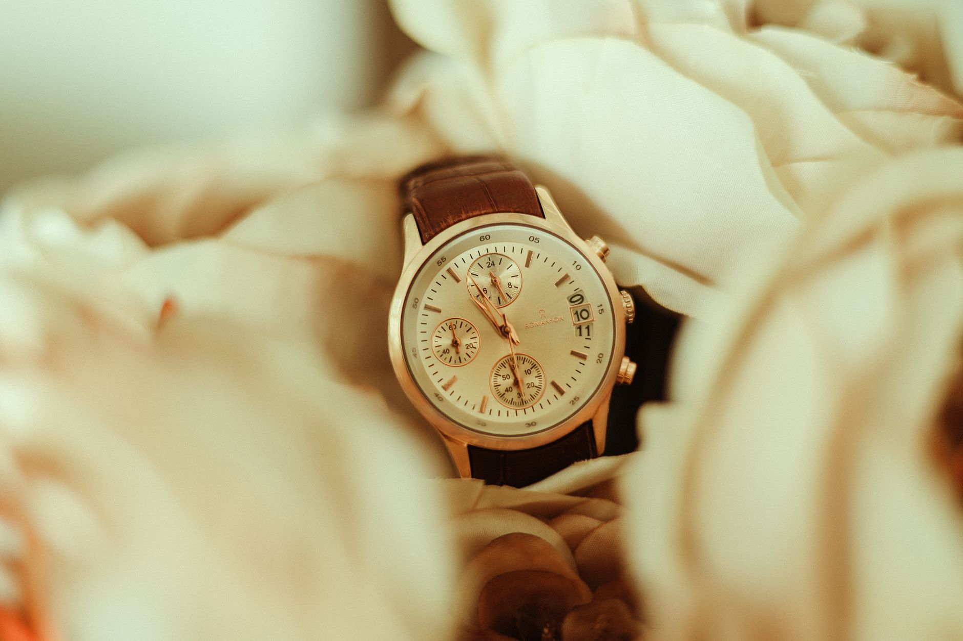 Close-up of a luxury Swiss wristwatch on a marble surface