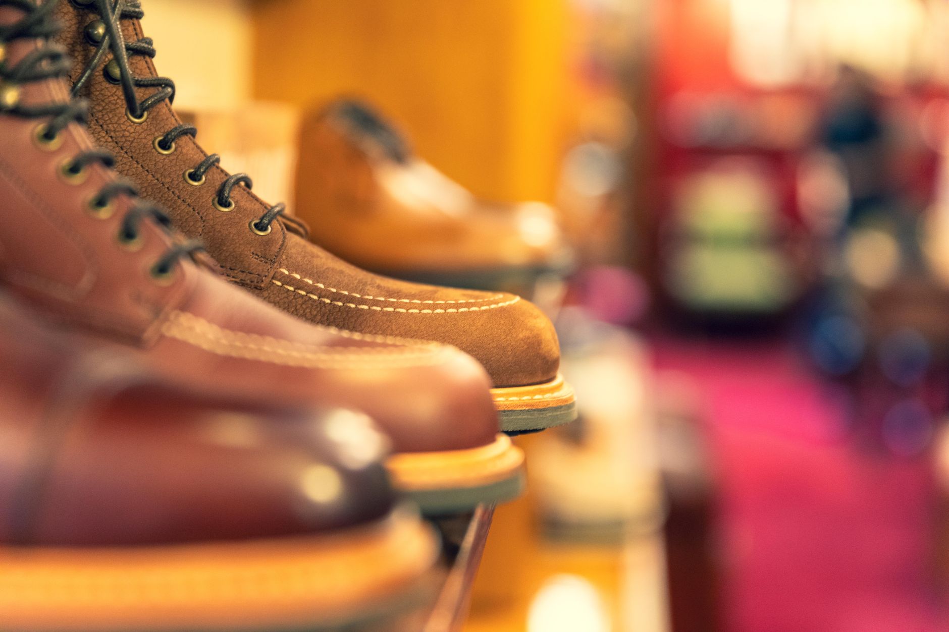 Craftsman working on a luxury custom shoe in a high-end footwear atelier