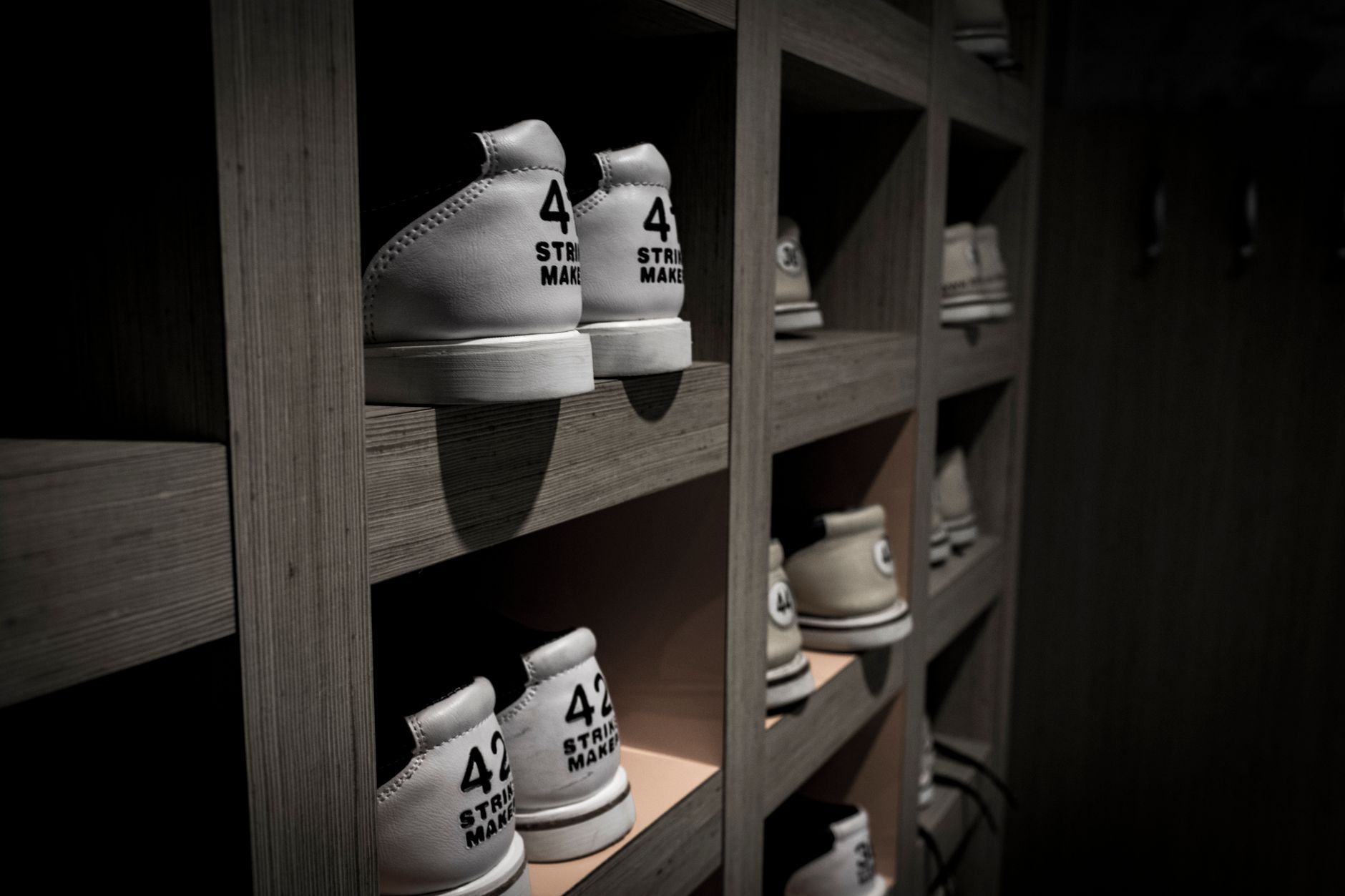 Sneakers displayed on a retail shelf in a footwear store