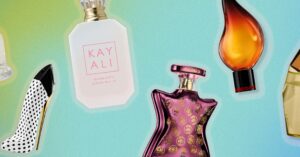 Assorted perfume bottles arranged on a light surface in summer light