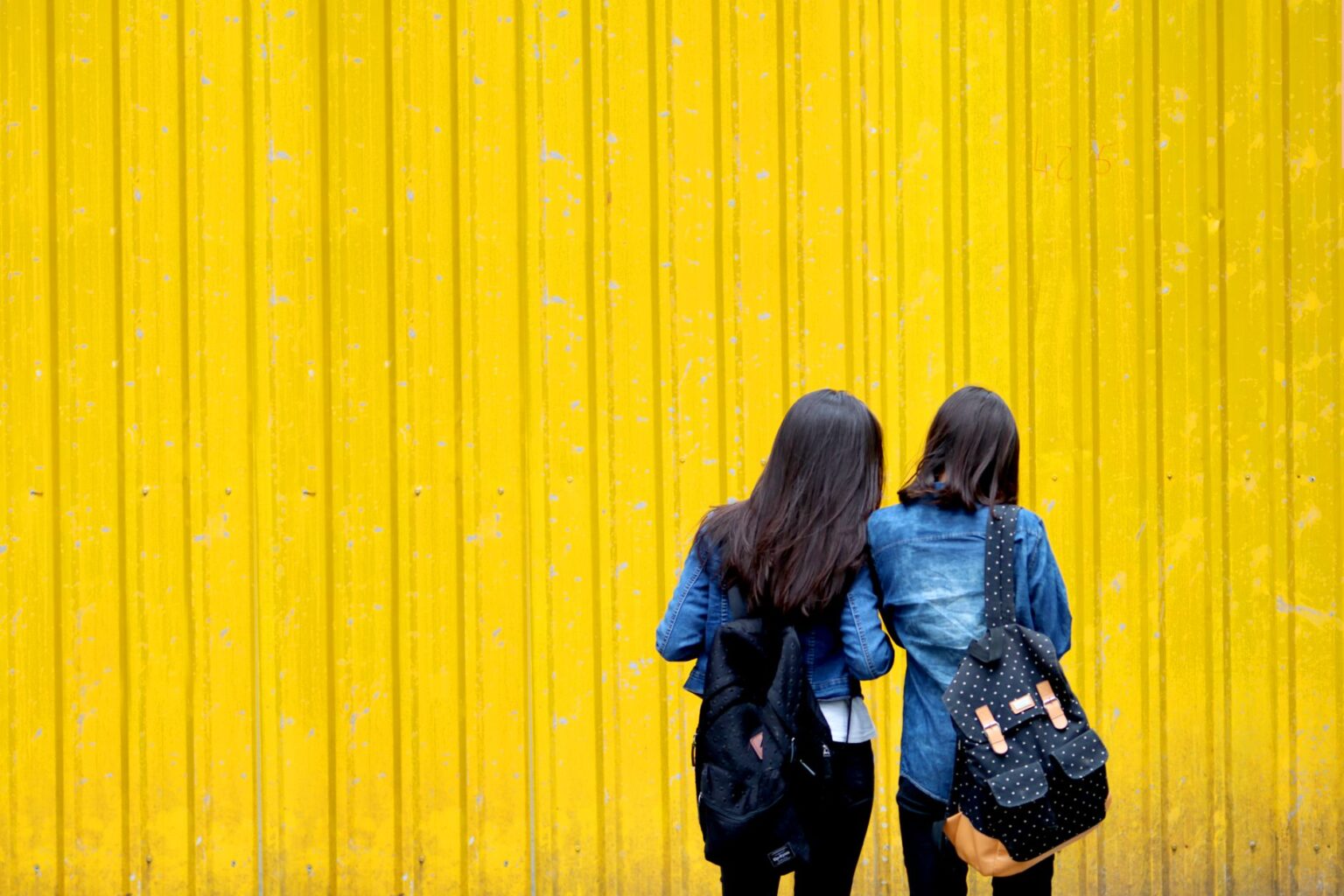 Two stylish women walking together on a New York street during a promotional appearance