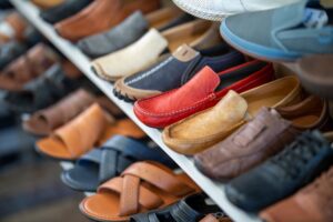 Elegant luxury footwear displayed on shelves inside a high-end shoe boutique