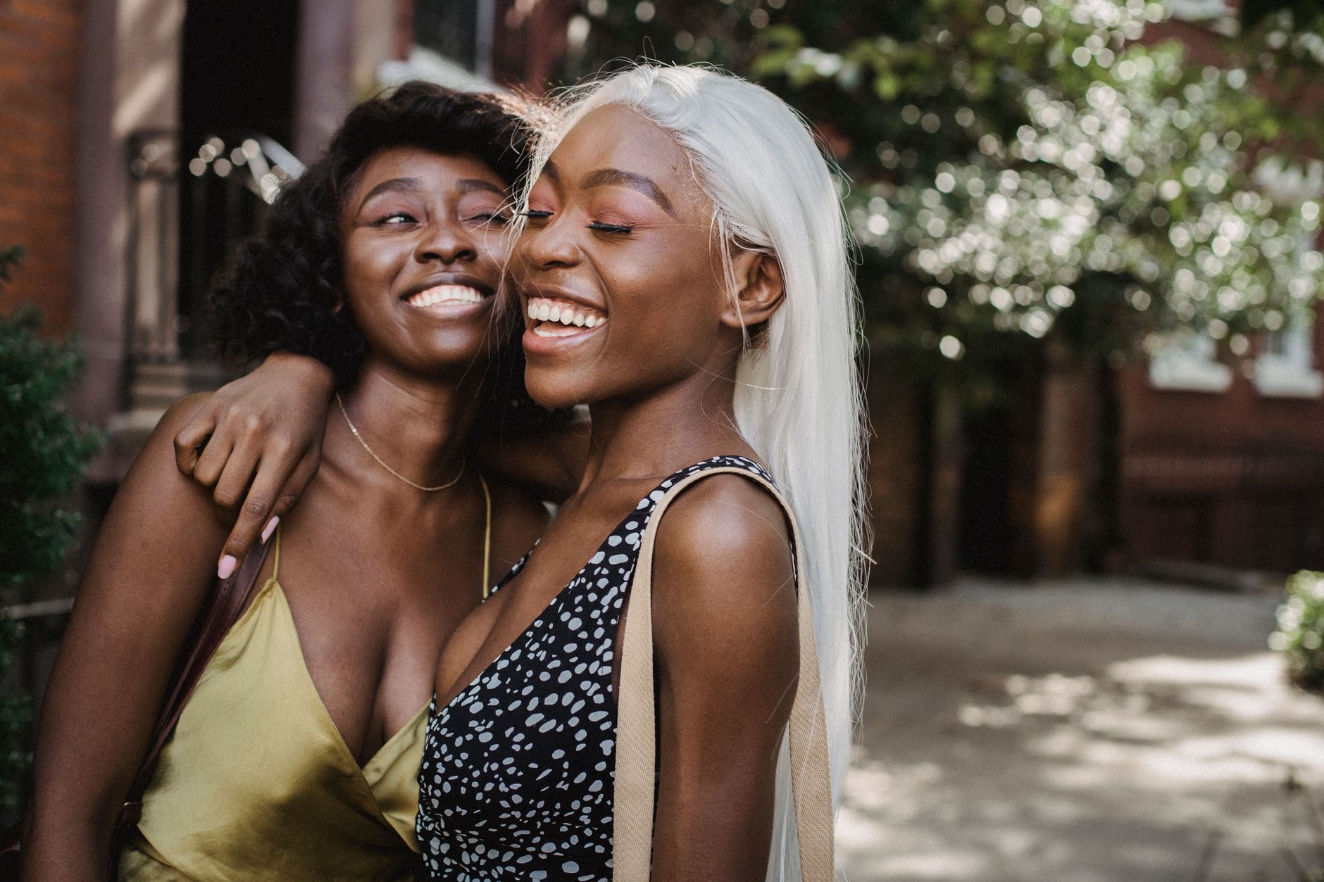 Two friends embracing outside, symbolizing loyalty and emotional connection