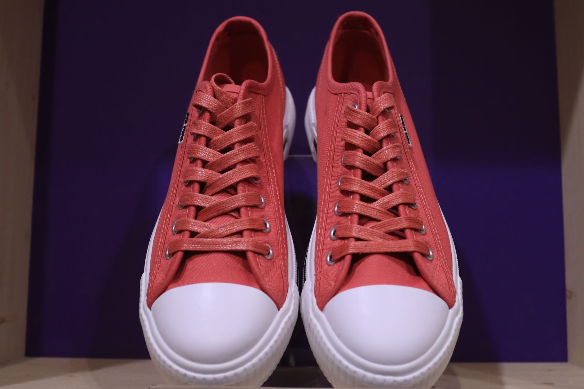 Running shoes displayed on a clean retail surface