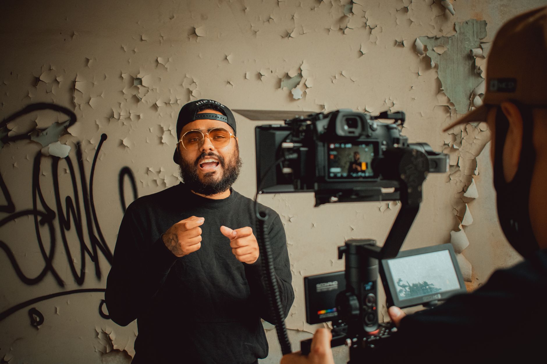 Behind-the-scenes view of a music video set with lighting equipment