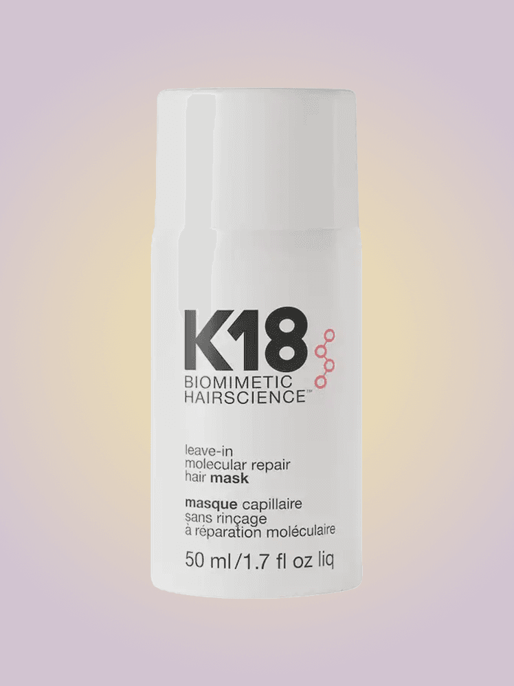 Woman applying deep conditioning hair mask treatment to damaged hair