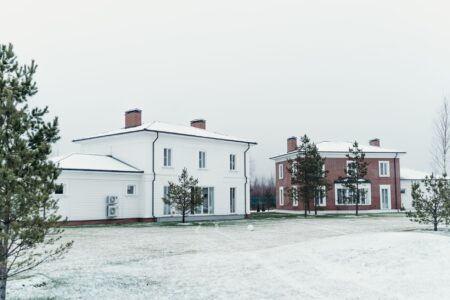 White House front facade on a clear day, formal grounds visible
