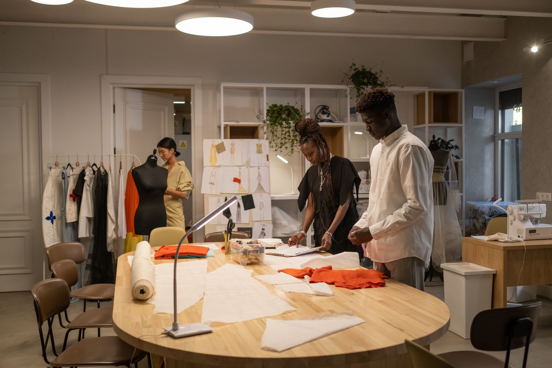 Creative professionals reviewing product designs in a modern office setting