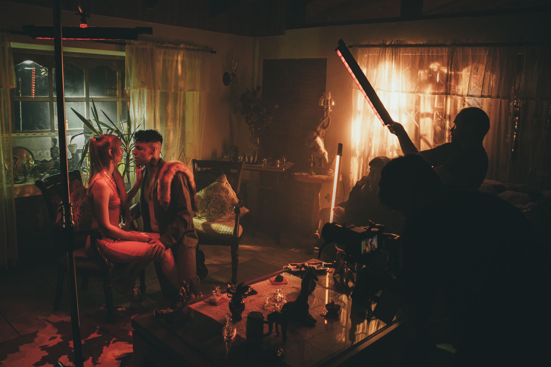 Behind-the-scenes view of a film production set with professional lighting rigs
