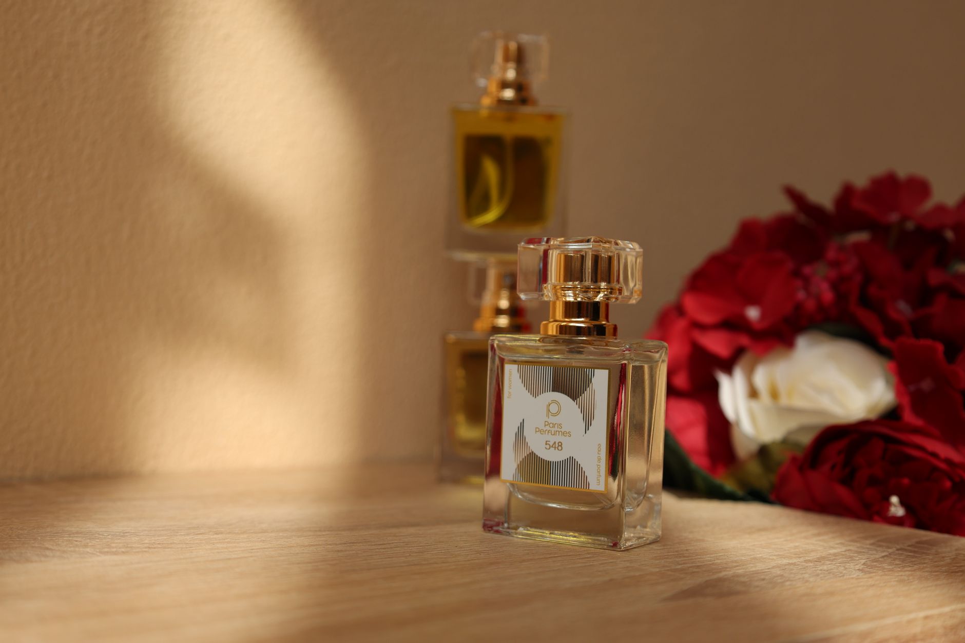 Collection of luxury fragrance perfume bottles on a vanity surface
