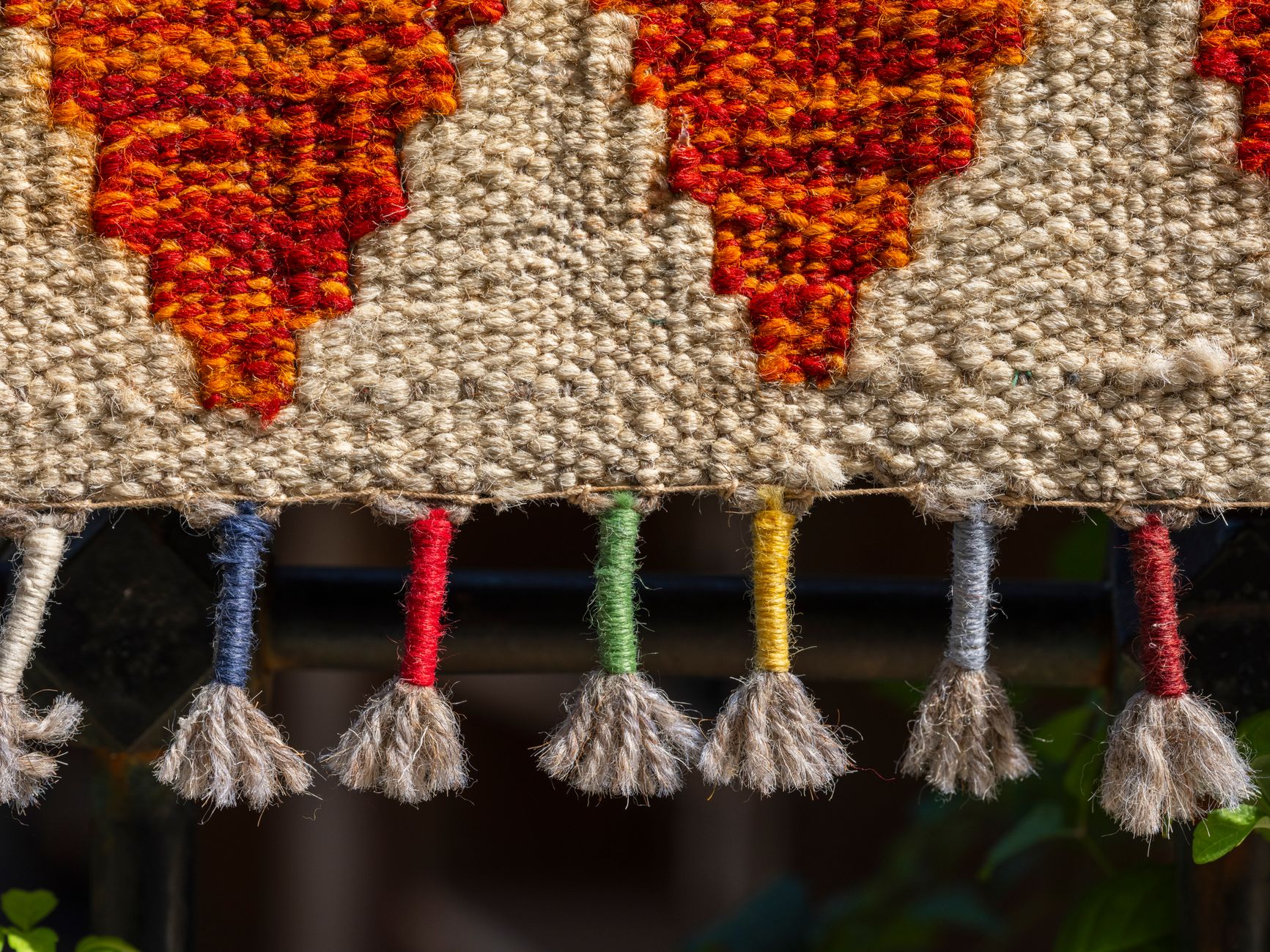 Close-up of fringe detailing on an elegant fashion garment