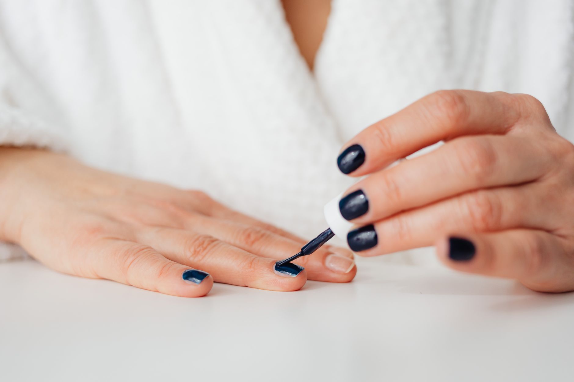 Perfectly finished nails with clean cuticles and smooth polish after a professional manicure